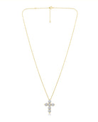 A delicate gold chain necklace featuring a cross pendant encrusted with clear stones, displayed against a solid white background.