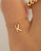 Barely there ring in 14k gold with small initial letter