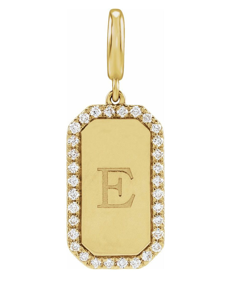 A gold initial pendant charm featuring a rectangular dog-tag style design with a border of small clear stones and an engraved letter 'E' in the center, shown on a plain white background.