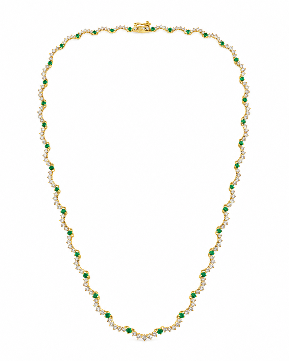 A yellow gold tennis necklace featuring small round-cut green emeralds and rows of clear pavé-set round stones, arranged in a scalloped pattern on a plain white background.