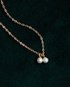 This Mini Pearl Pendant Necklace is the perfect complement for your evening wear or casual wardrobe. Crafted from 14k gold, this delicate necklace features a small cultured pearl, lending it a minimalist and elegant look. With this classic and versatile accessory, you're sure to make a statement.