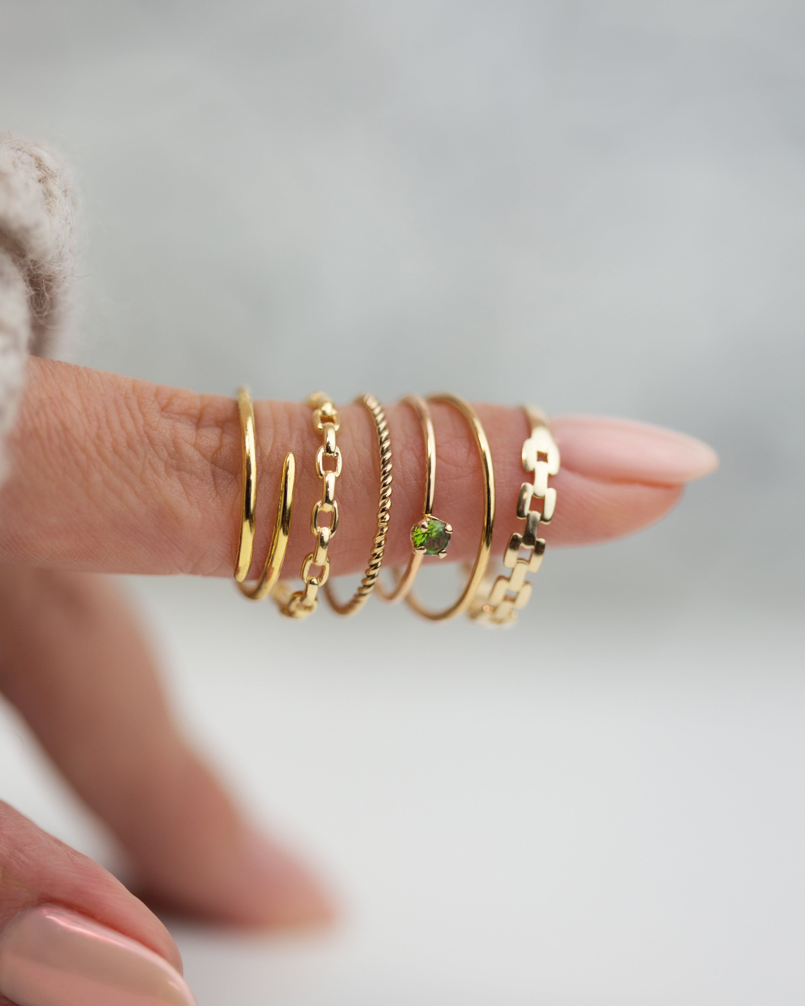 This lustrous 14-karat yellow gold ring is adorned with an open square link design, polished to a brilliant finish. Worn alone, it is a statement of style. When paired with other pieces, it adds a touch of drama to any look.