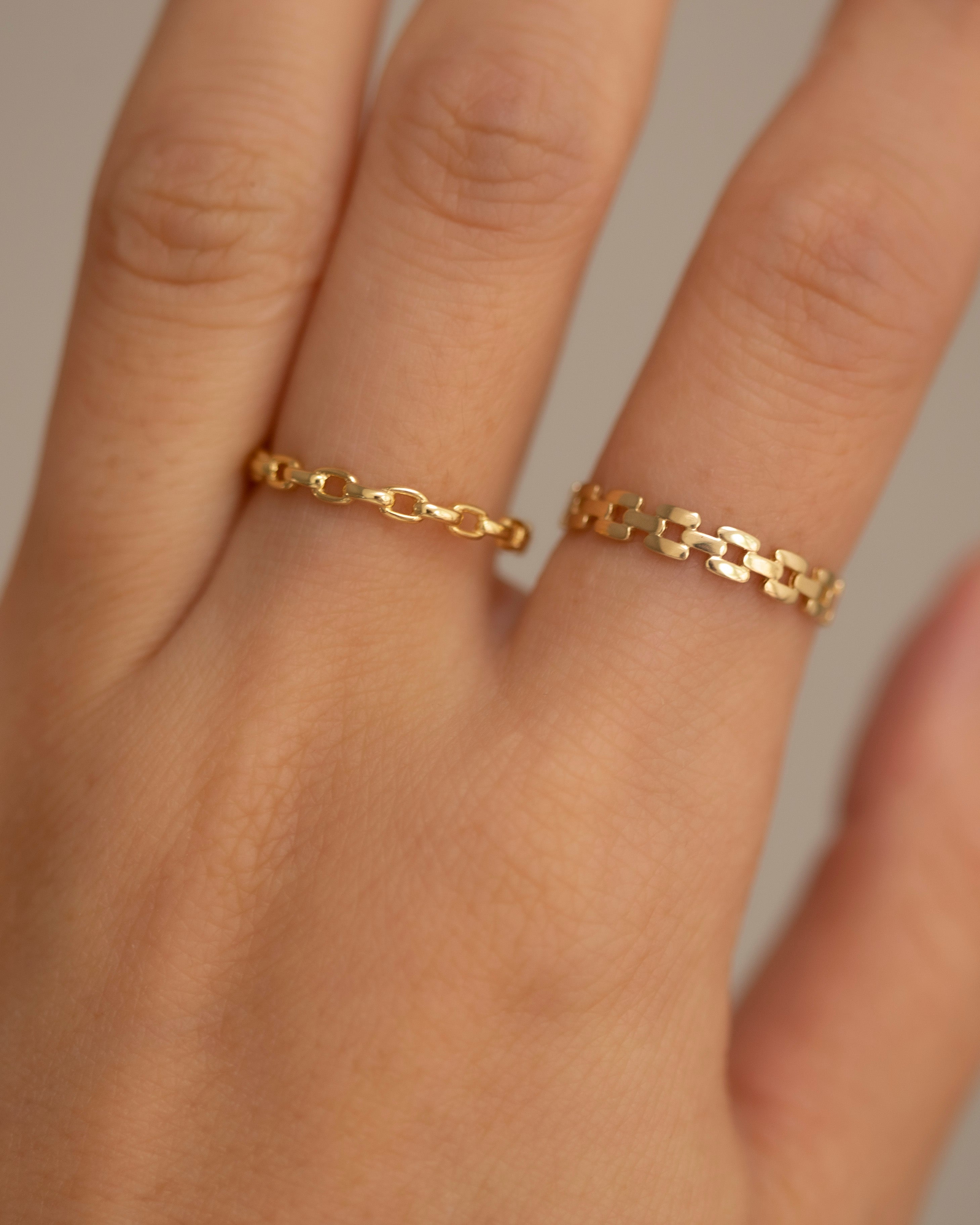 This lustrous 14-karat yellow gold ring is adorned with an open square link design, polished to a brilliant finish. Worn alone, it is a statement of style. When paired with other pieces, it adds a touch of drama to any look.