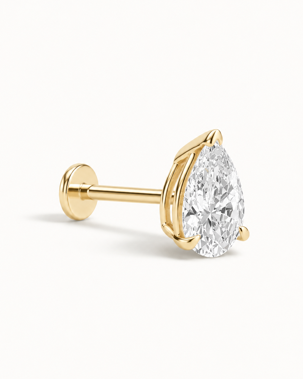 A pear-cut diamond stud earring in yellow gold, featuring a brilliant-cut clear gemstone set in a four-prong gold setting on a post with a flat back, shown on a clean white background.
