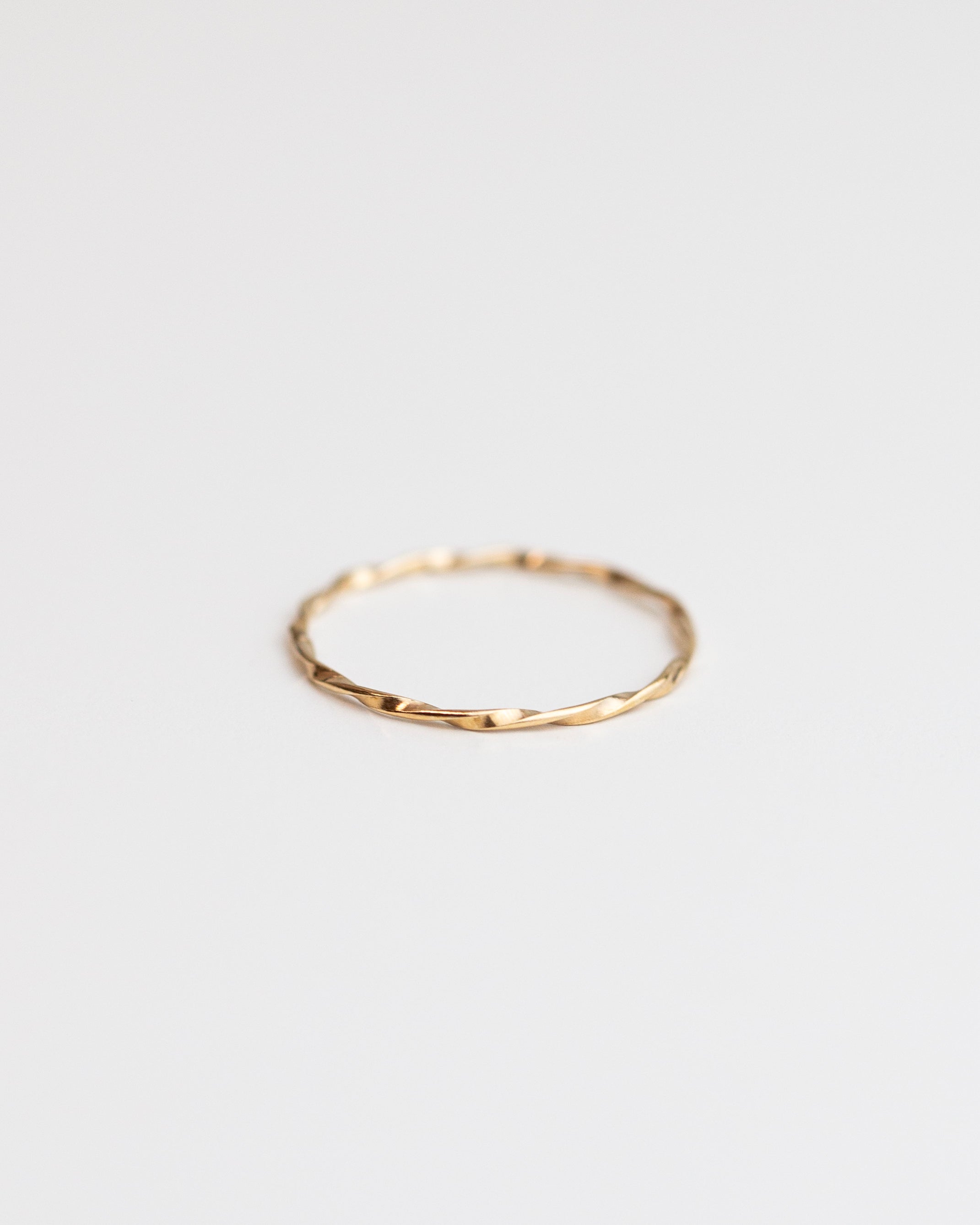 Modern and timeless twisted wire ring. Twisted Stacker Gold Ring -It's a simple and dainty everyday jewelry that adds a tiny sparkle to your finger :) Perfect as a stacking ring or by itself.