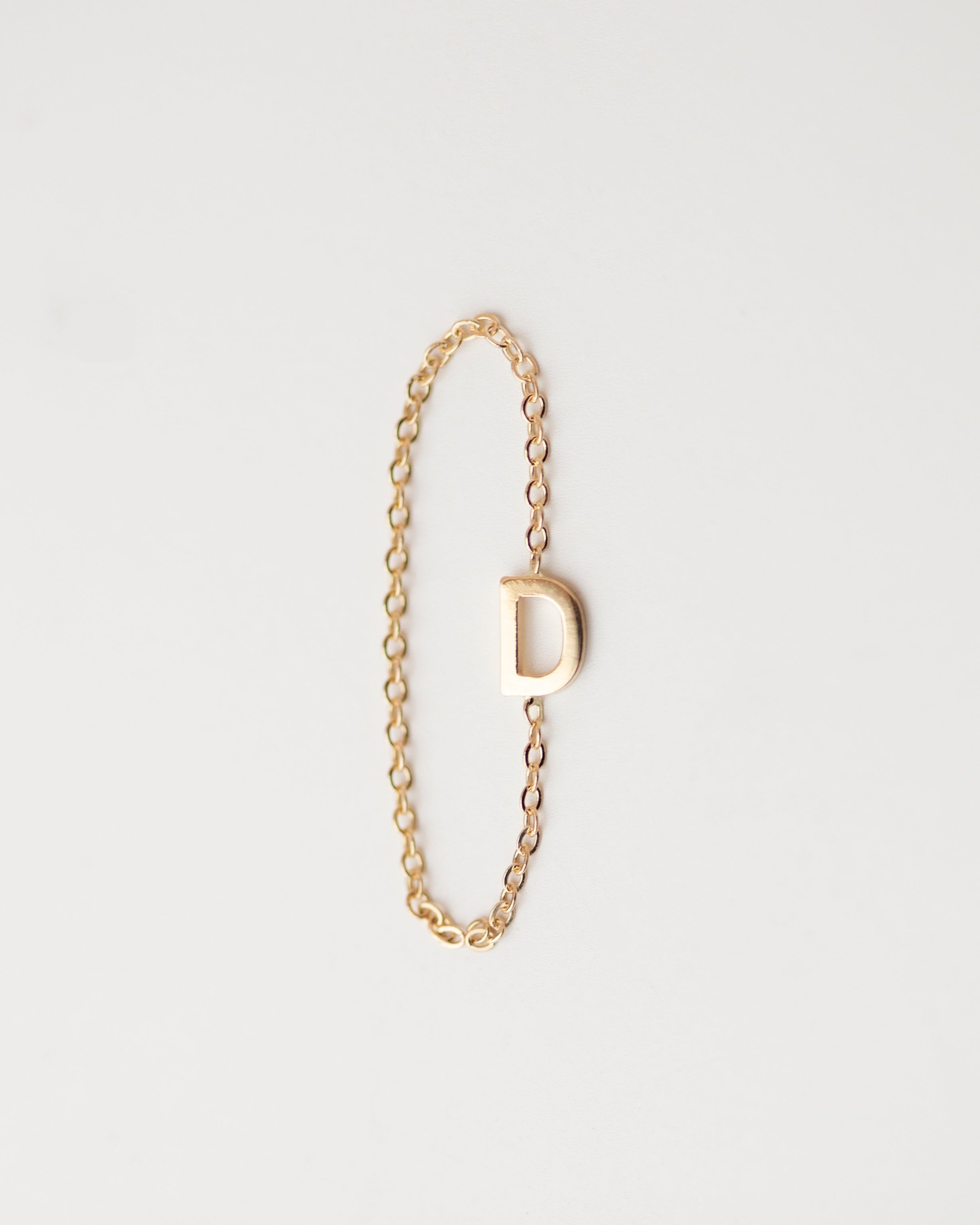 Elegant 14K Monogram Ring: A subtle, dainty 14k gold ring featuring a small monogram for a modern and timeless touch. Luxurious and sophisticated, this delicate chain ring exudes exclusivity.

Simple, minimalist everyday&nbsp; Initial Ring - Perfect as a stacking ring or by itself.
