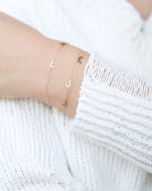 Customize your 14K solid gold initial bracelet. An understated, sleek everyday accessory. Ideal for gifting your loved one.