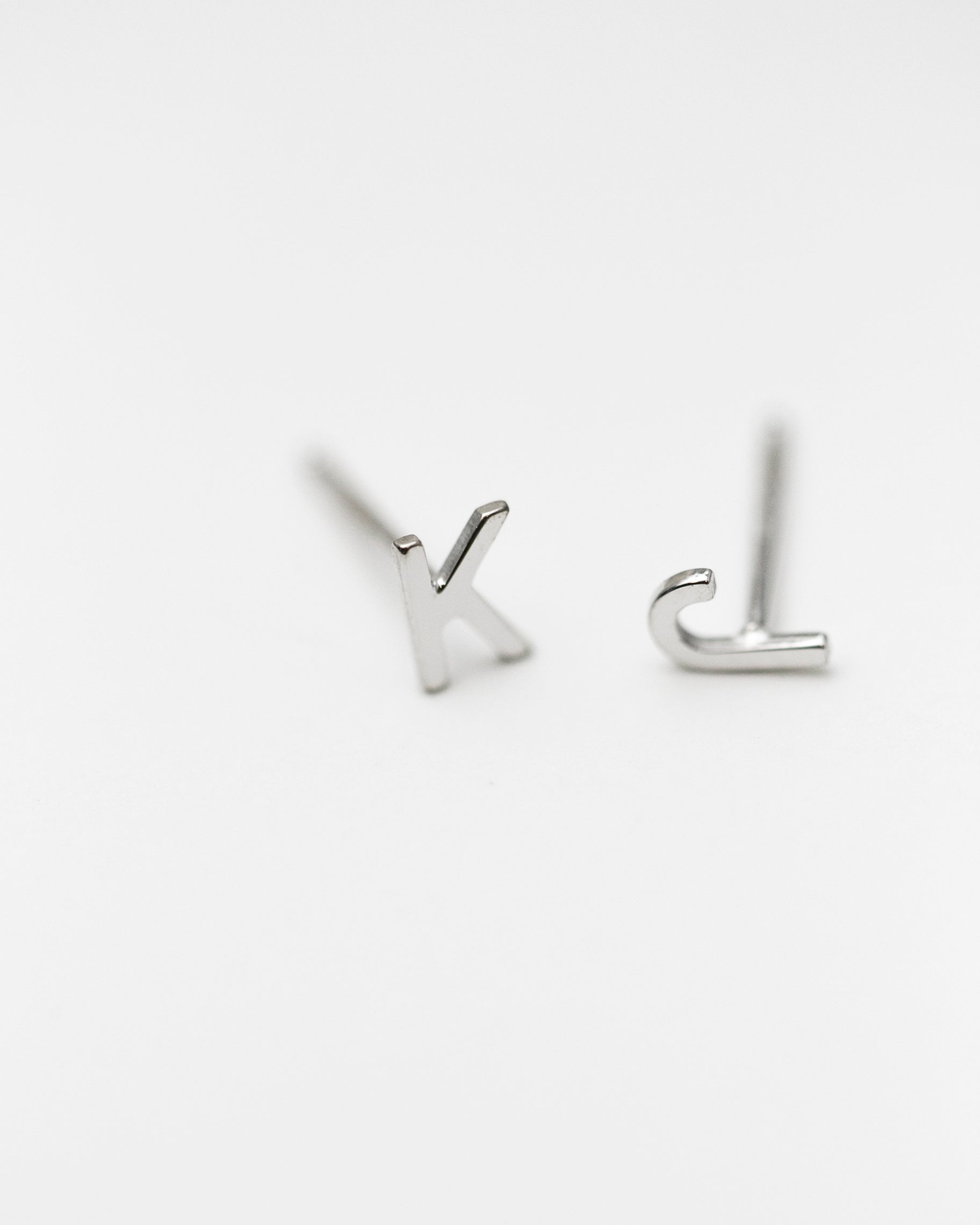 14K Initial stud Earrings - Enhance your style with a touch of sophistication and elegance using our 14K Solid Gold Initial Stud Earrings. Show off your initial and elevate your look with this exquisite accessory. Can be worn alone or paired with other earrings to create a stylish ear stack.