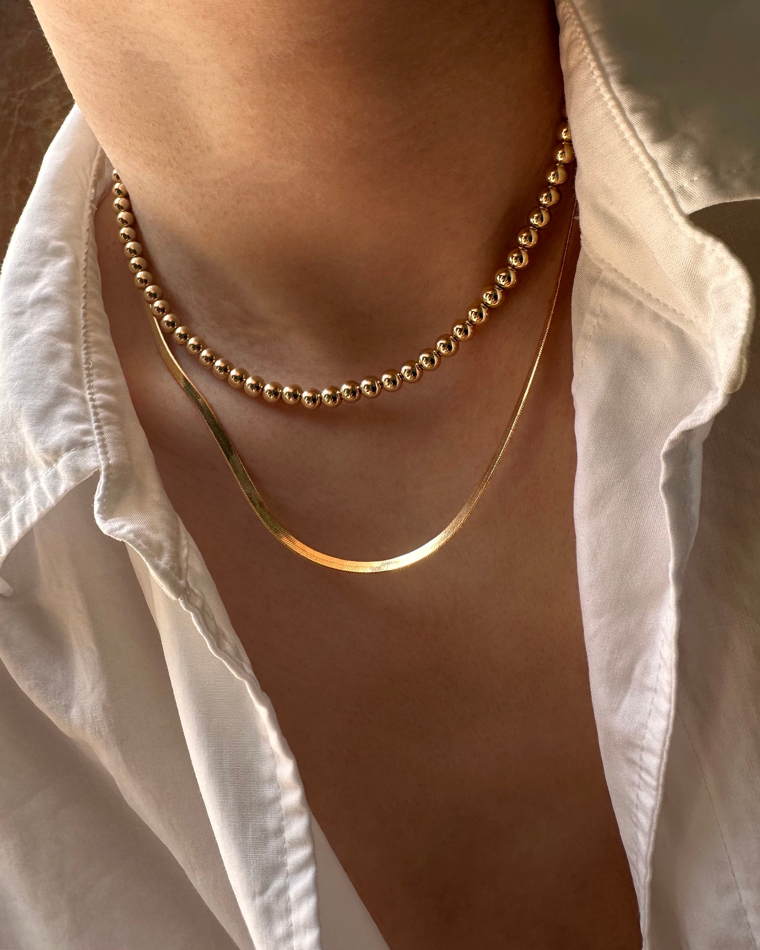 14k Herringbone Snake Chain Necklace

Our 14k Herringbone Snake Chain Necklace is the perfect addition to any wardrobe. Crafted from 14k gold, this necklace is lightweight and long lasting. The intricate herringbone design ensures durability, without sacrificing style. Whether it’s for a special occasion or everyday wear, this necklace is always in style.