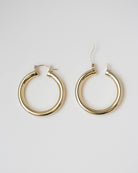 Expertly crafted from high-quality gold, these Chunky Hoop Earrings are a timeless addition to your jewelry collection. The classic design ensures versatility and elegance for any occasion, making them a must-have staple piece in your wardrobe.