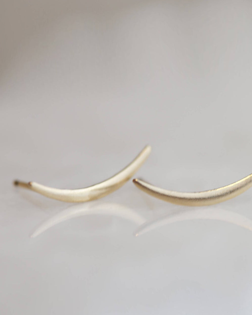 Swoop Climber Earrings

Minimal Swoop Climber Earrings in 14K Gold filled - Hammered or Shinny,
Little Crescent Moon studs are so simple, neat and stylish!