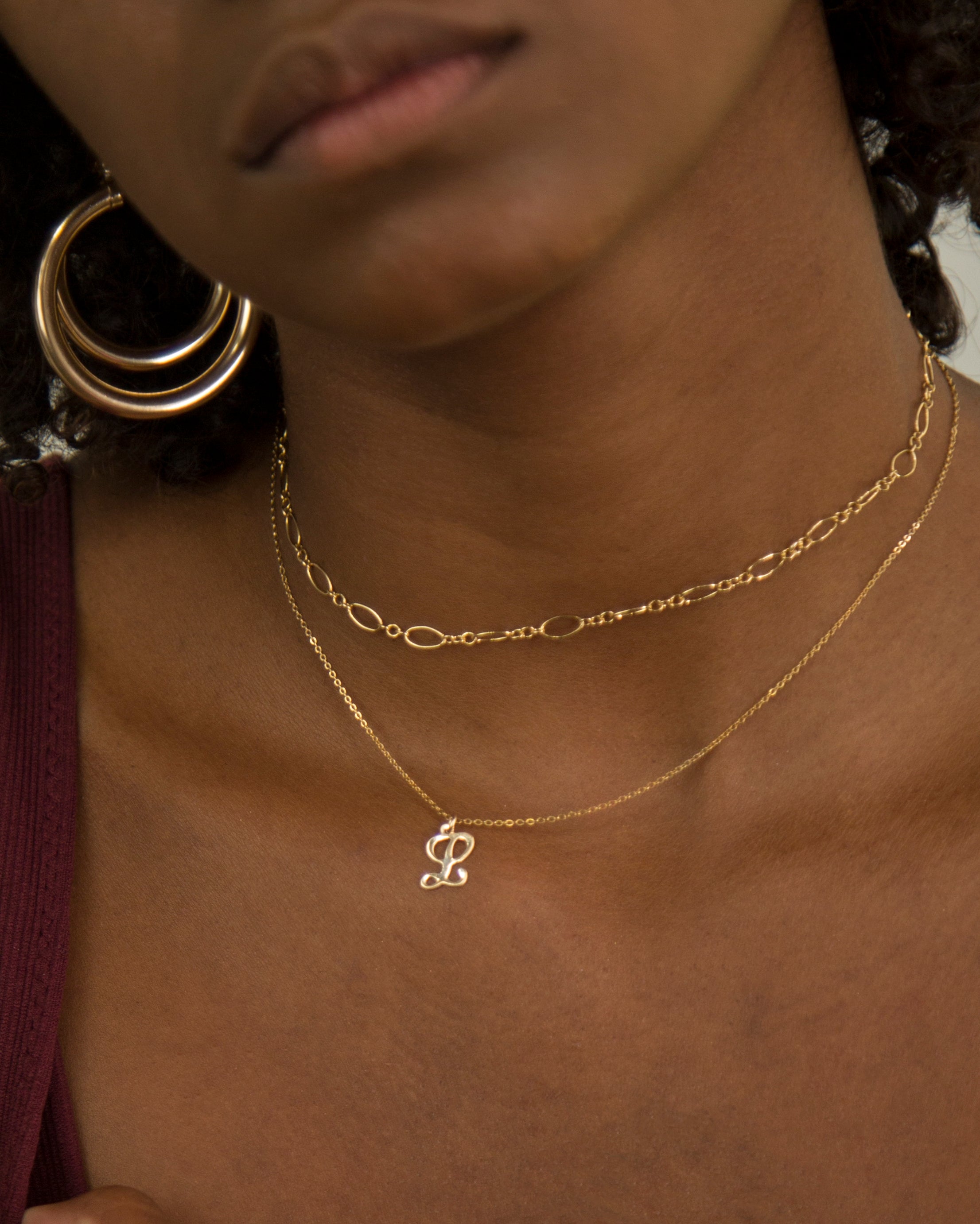 Cursive Letter Charm Necklace. Perfect wearing alone or layering with your favorite necklaces.