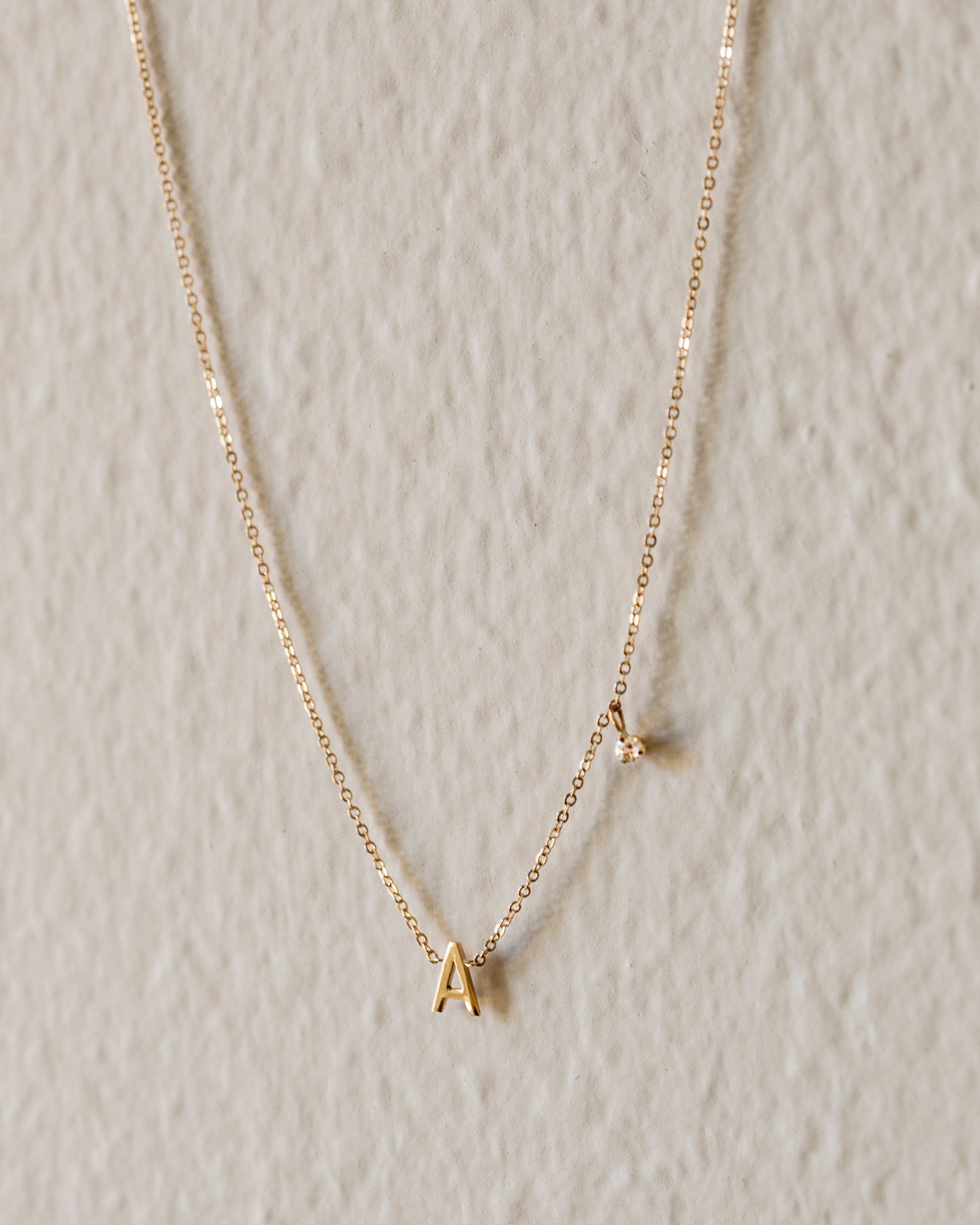 Personalized initial necklace with a diamond dangle