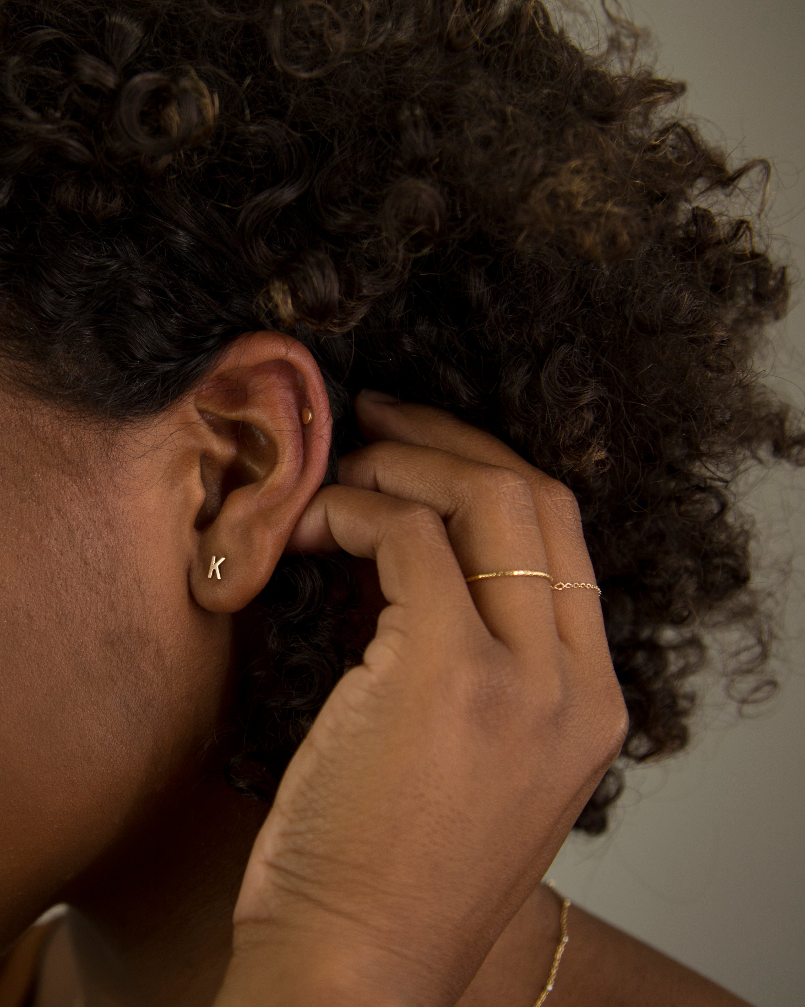 14K Initial stud Earrings - Enhance your style with a touch of sophistication and elegance using our 14K Solid Gold Initial Stud Earrings. Show off your initial and elevate your look with this exquisite accessory. Can be worn alone or paired with other earrings to create a stylish ear stack.