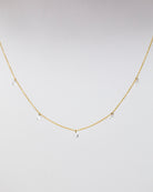 14k Gold chain with beautiful diamond in a drilled jump ring setting