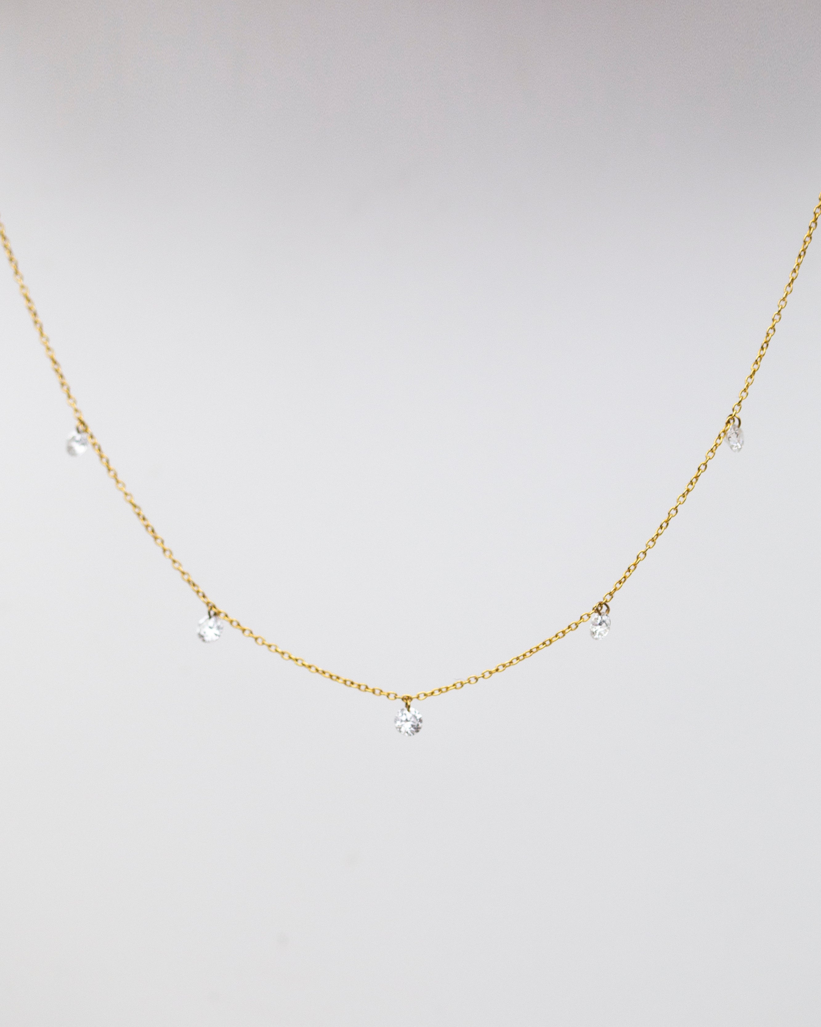 14k Gold chain with beautiful diamond in a drilled jump ring setting