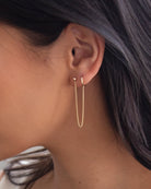 14k Gold Hoop Chained Earring

Small Hoop chained onto 3mm ball stud earring.
The 14k gold hanging chain makes this earring unique and chic.