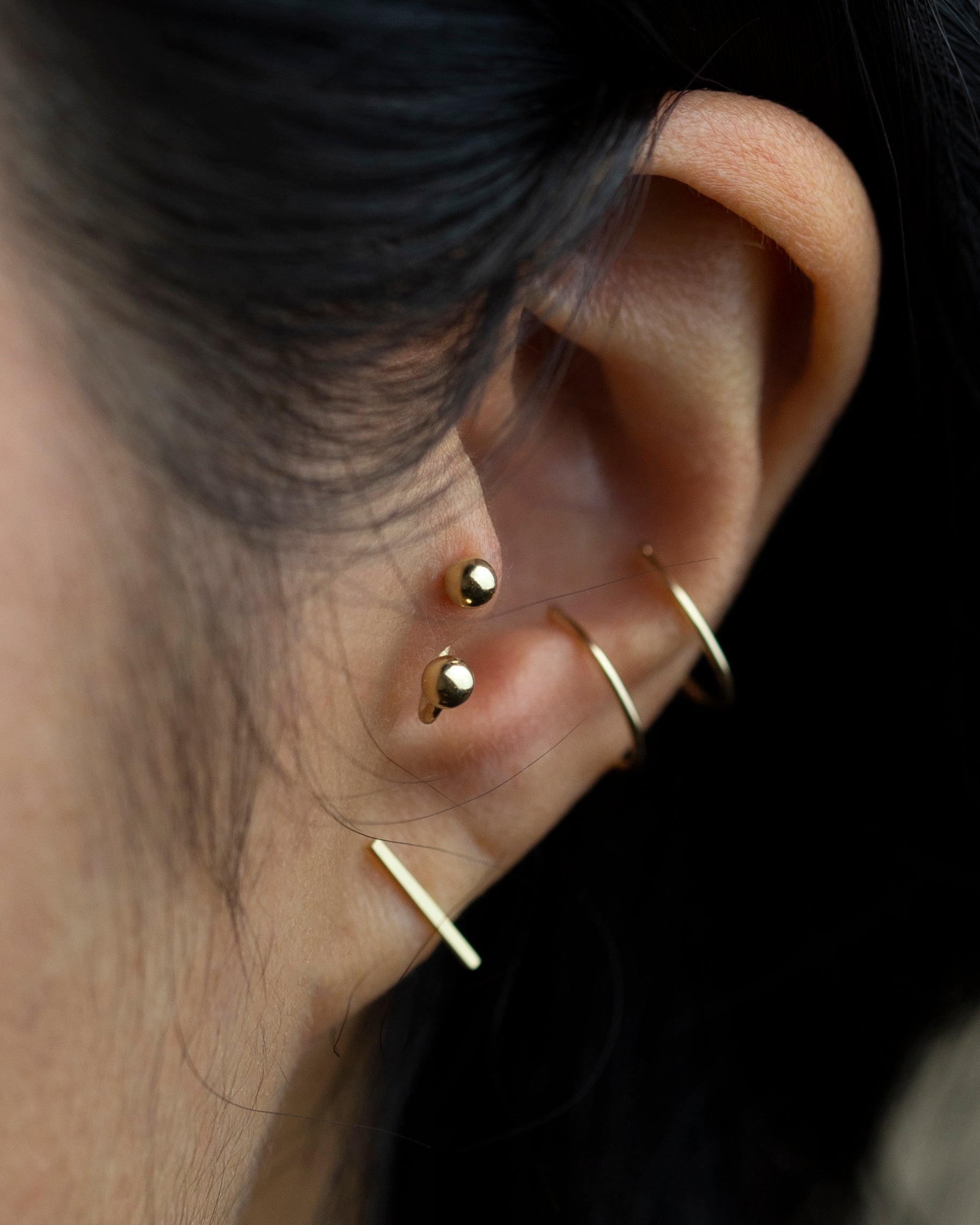 gold earrings by E&E