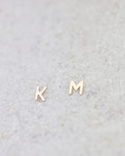 14K Initial stud Earrings - Enhance your style with a touch of sophistication and elegance using our 14K Solid Gold Initial Stud Earrings. Show off your initial and elevate your look with this exquisite accessory. Can be worn alone or paired with other earrings to create a stylish ear stack.