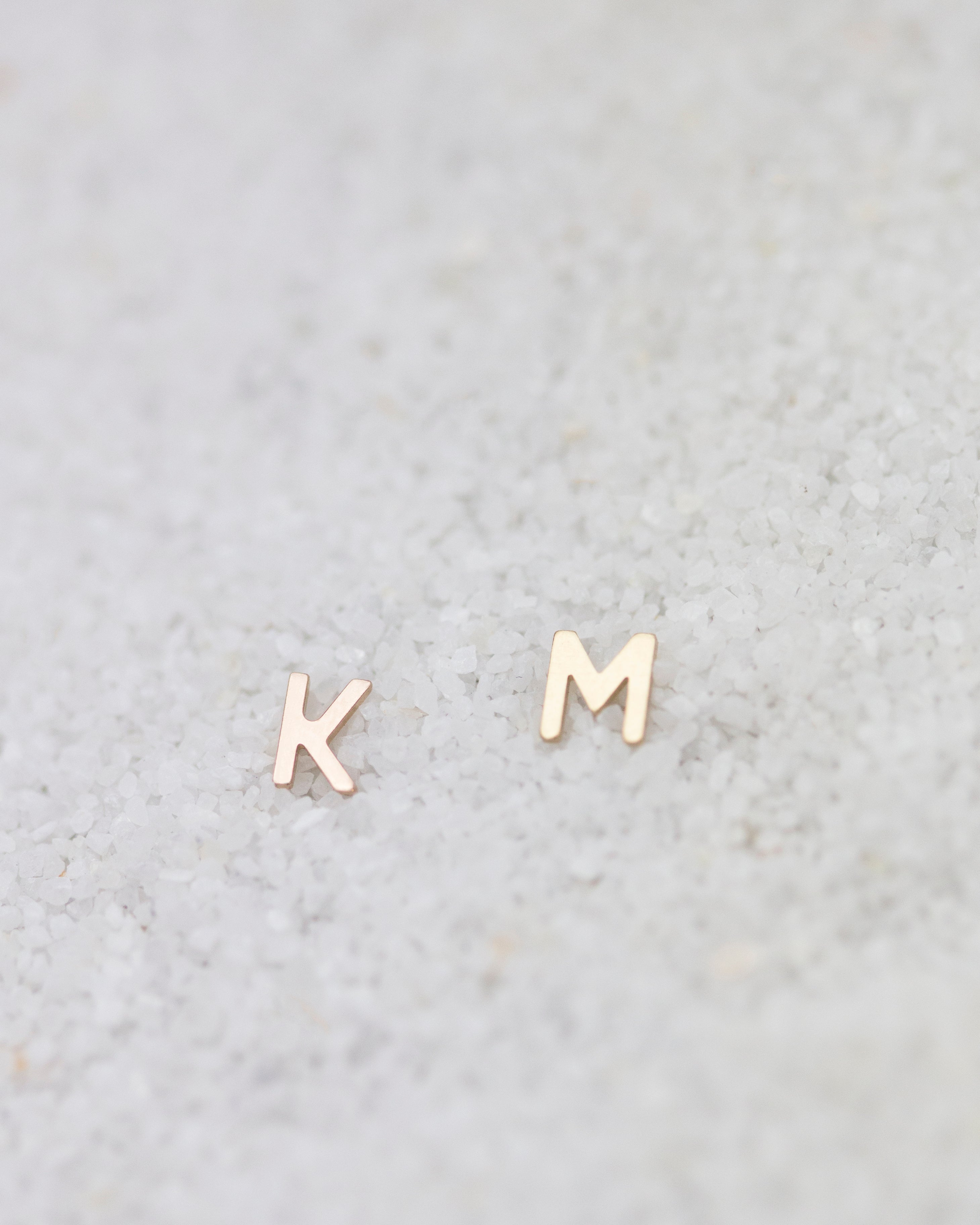 14K Initial stud Earrings - Enhance your style with a touch of sophistication and elegance using our 14K Solid Gold Initial Stud Earrings. Show off your initial and elevate your look with this exquisite accessory. Can be worn alone or paired with other earrings to create a stylish ear stack.