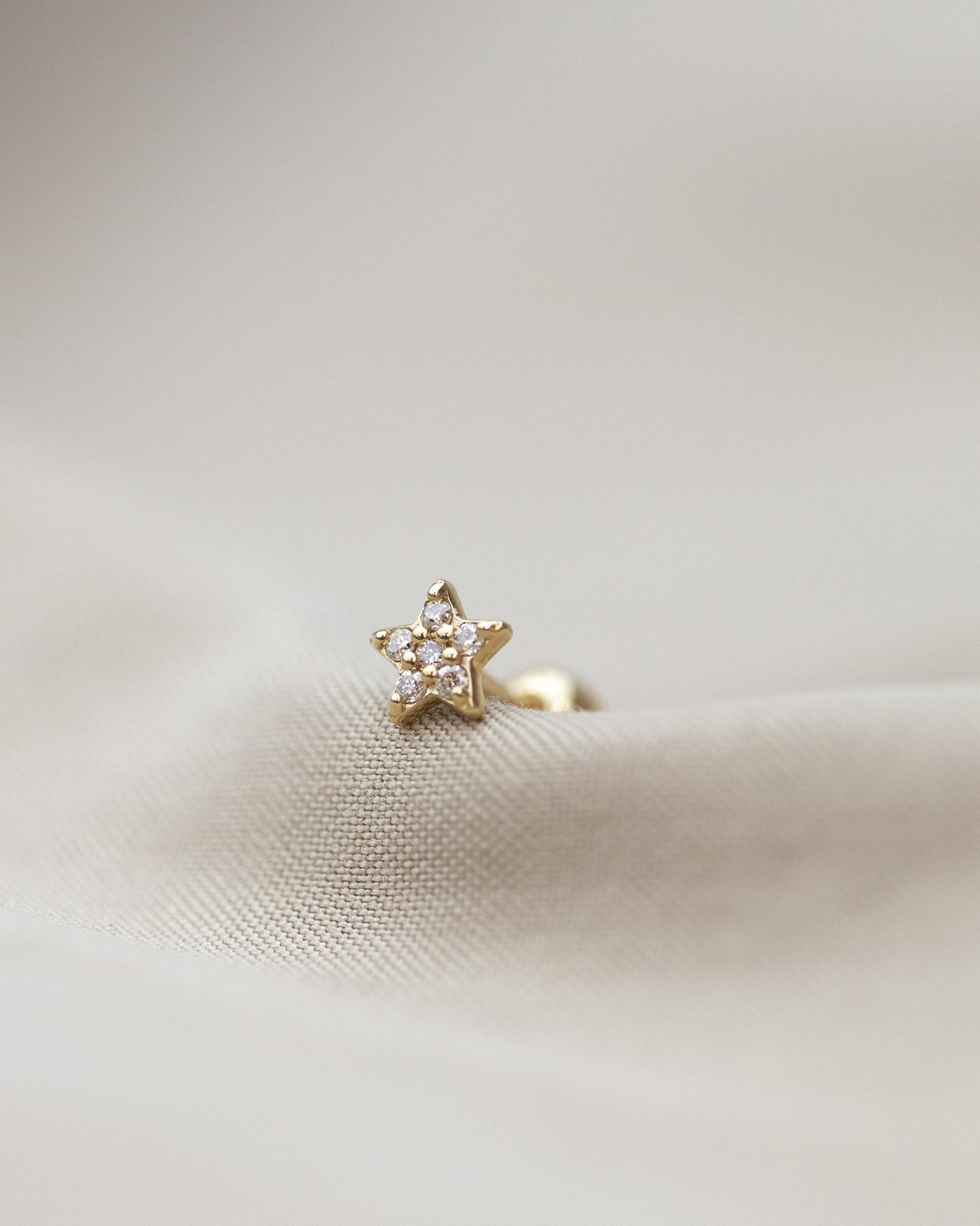 14K Yellow&nbsp;mini star stud earring
Can be worn as stud for Cartilage as well.

Minimalist, high quality, and timeless.
Very secure and comfortable to wear.