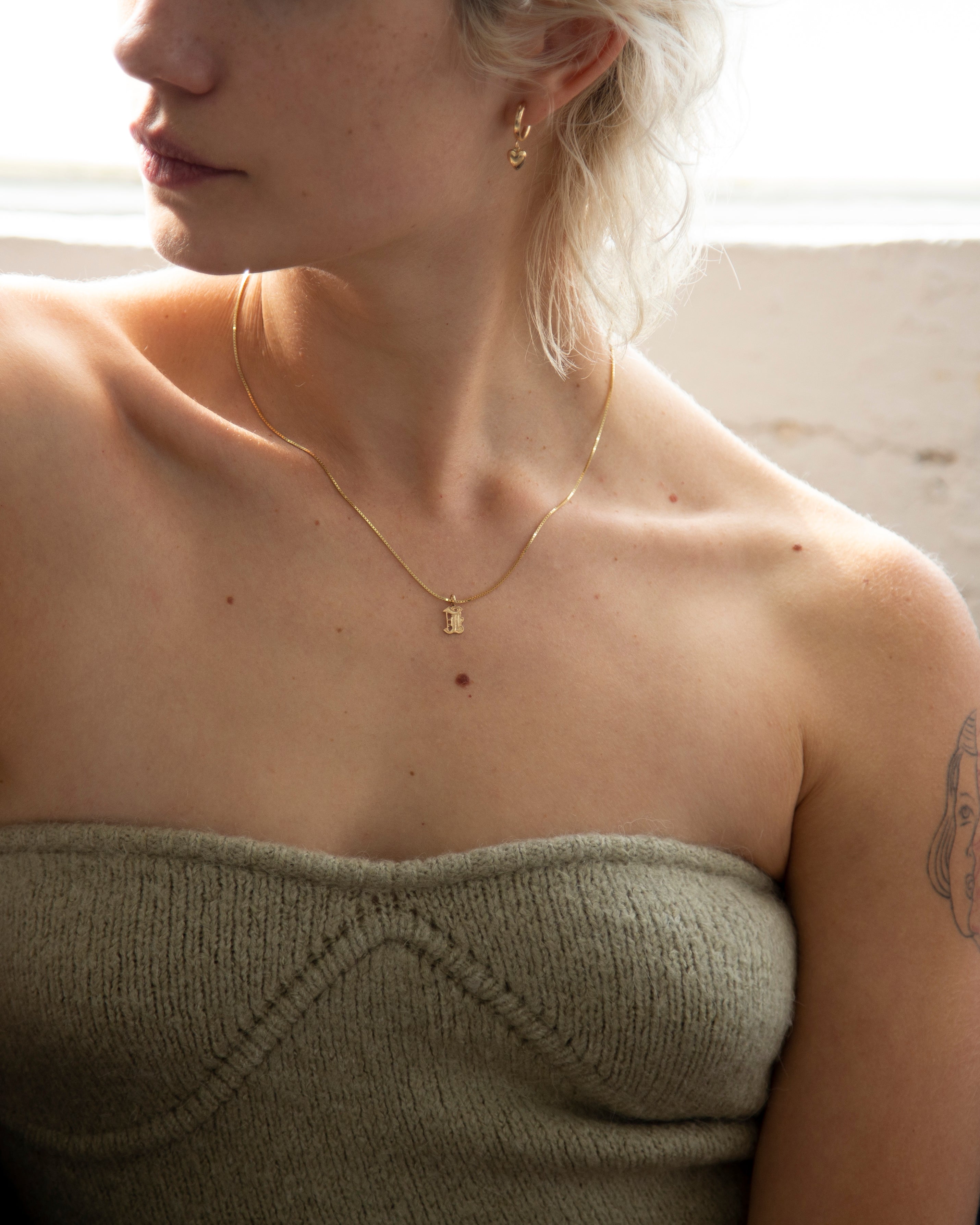 This Old english initial necklace is the perfect combination of edgy and elegant to make a unique statement.