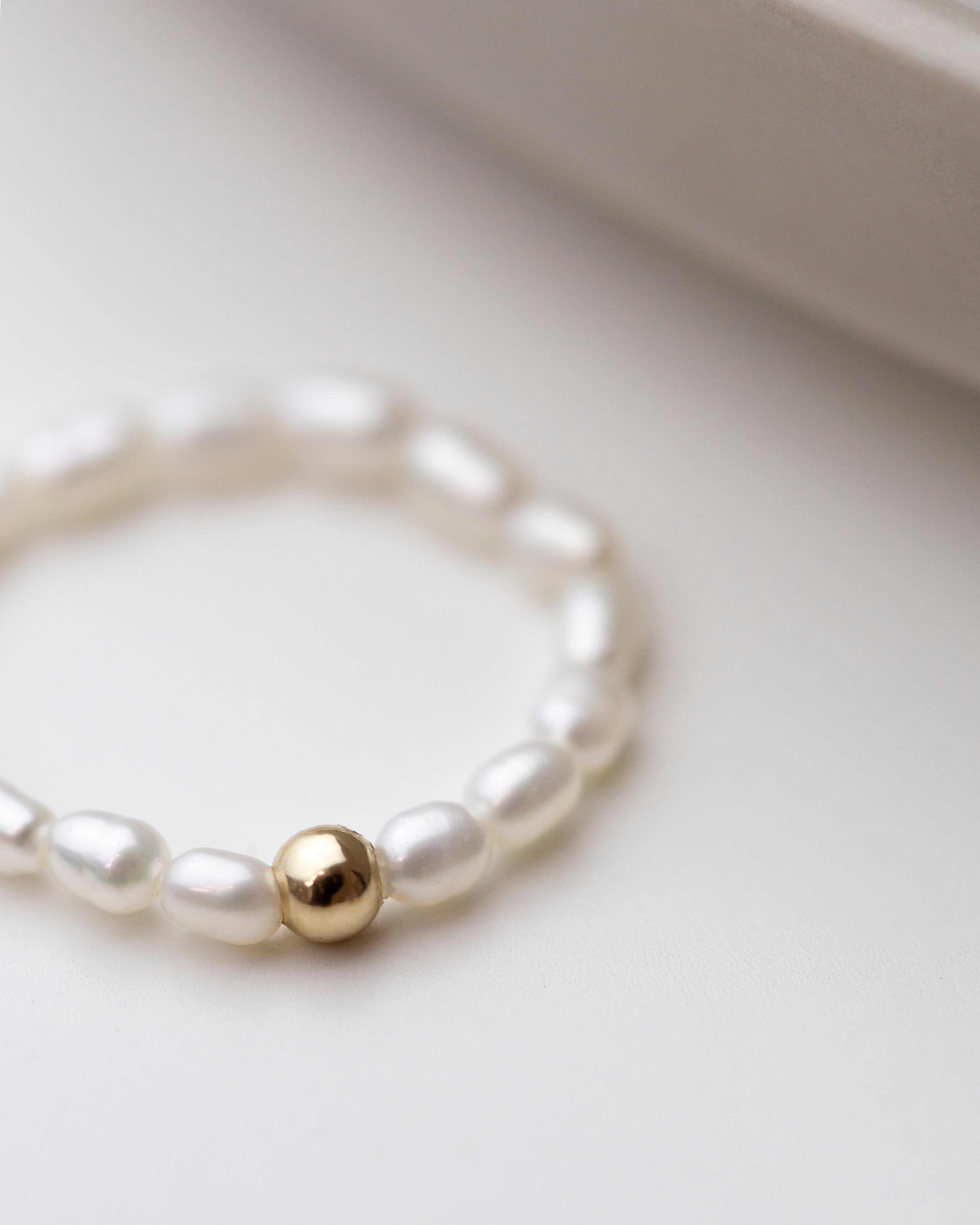 Baby Lotus Pearl Ring
Made with mini rice shape fresh water pearls and gold filled bead on a
comfy stretchy elastic band. Baby lotus pearl ring will be the perfect addition to your ring stack!