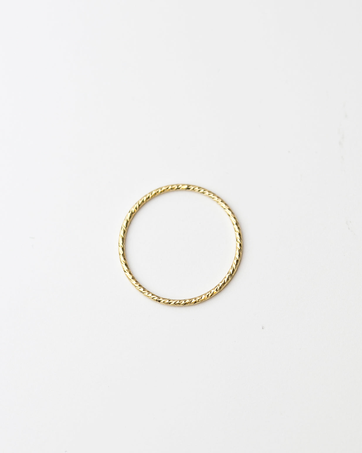 Crafted from 14k gold and featuring a diamond-cut design, these stacking rings offer a dainty and simplistic look that is perfect for everyday wear.