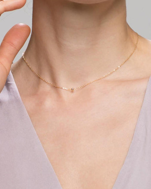  a delicate gold bead necklace l